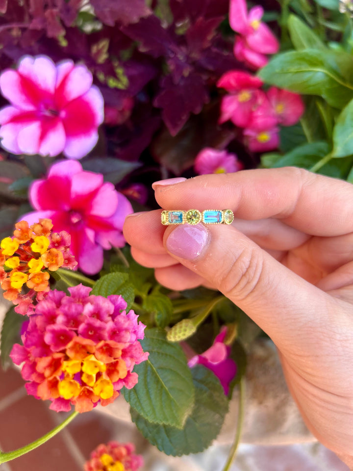 14kt Emerald Cut Blue Topaz and Round Peridot Band