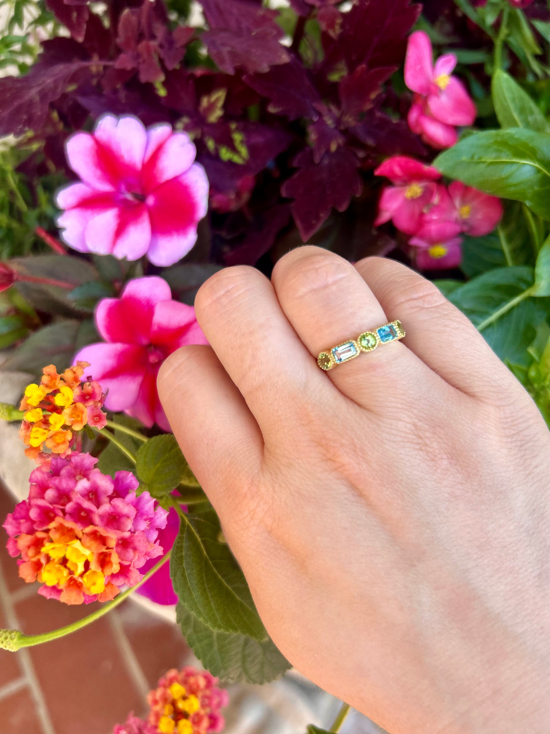 14kt Emerald Cut Blue Topaz and Round Peridot Band