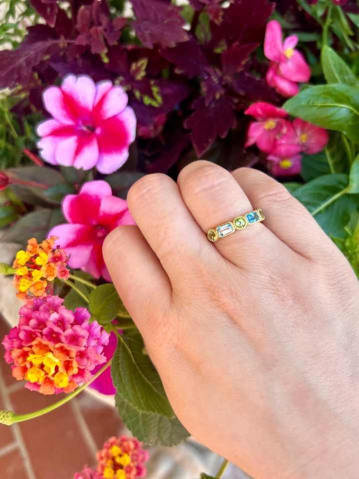 14kt Emerald Cut Blue Topaz and Round Peridot Band