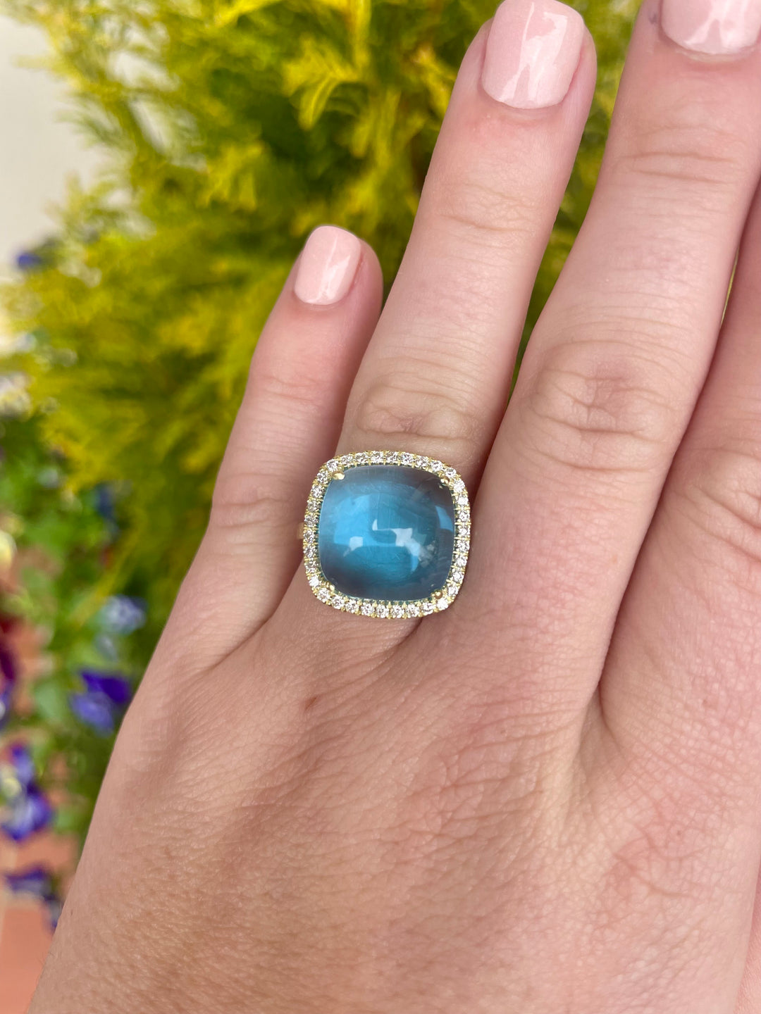14kt Gold Swiss Blue Topaz Ring with .34pts Dia
