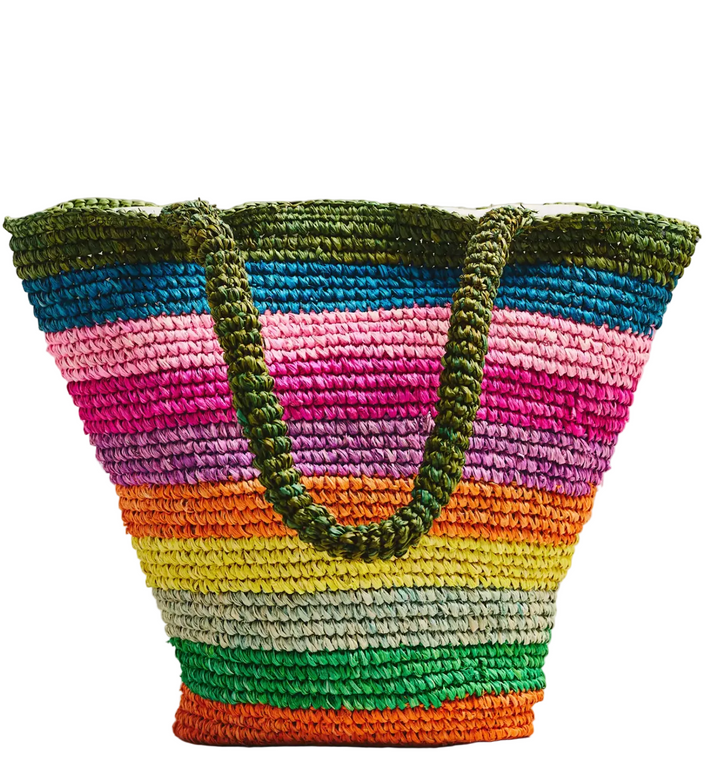 Colorful striped woven basket with a handle on a light background